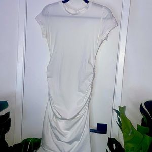 Body hugging - White Dress - Size Medium - Brand New. Never worn.